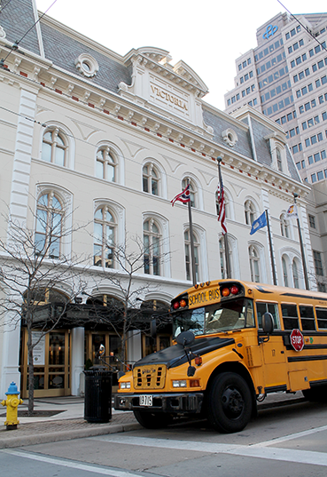 School bus parked in front of Victoria Theatre