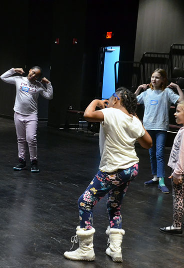 Children learning acting techniques