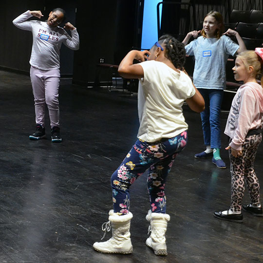 Children learning acting techniques