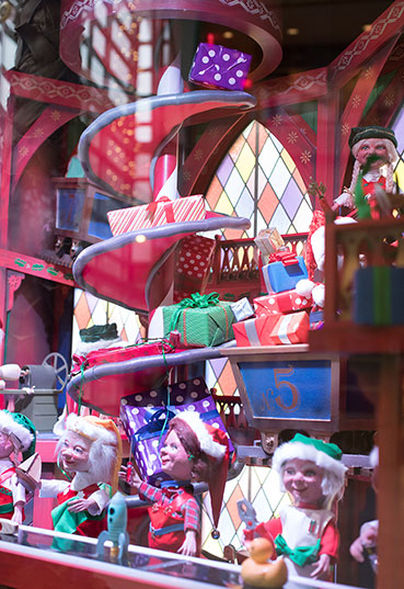 Animatronic elves assemble presents in the North Pole Rike's Holiday Window Box