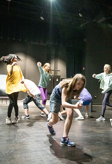 Students participate in an acting class