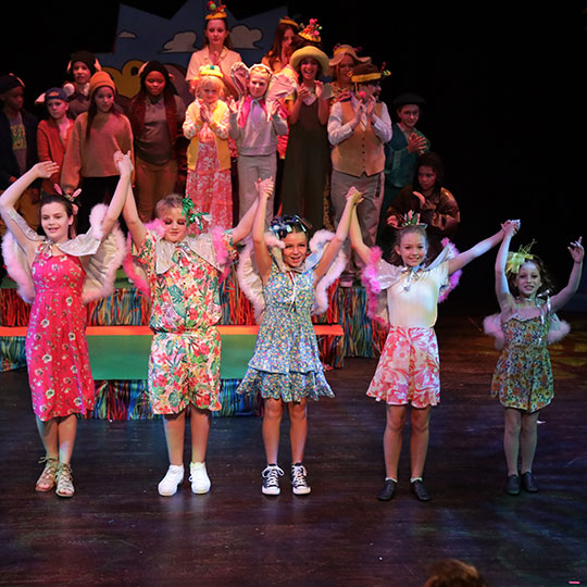 Young actors on stage in a Dayton Live Creative Academy production
