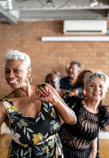 Dance class participants enjoy themselves while dancing
