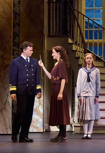 Kevin Earley (Captain Georg von Trapp) and Cayleigh Capaldi (Maria Rainer) with the von Trapp Children (l to r) Ariana Ferch (Liesl), Eli Vander Griend (Friedrich), Ava Davis (Louisa), Benjamin Stasiek (Kurt), Haddie Mac (Brigitta), Ruby Caramore (Marta), Luciana VanDette (Gretl) in THE SOUND OF MUSIC. Photo by Jeremy Daniel.